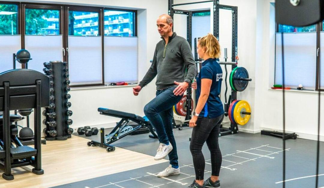 Physiotherapist assisting patient with functional mobility training and daily activity rehabilitation at home